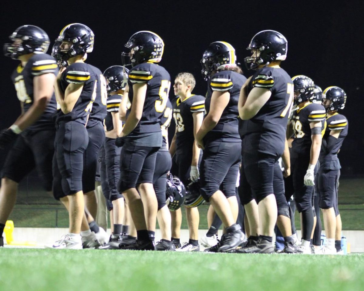 Atlantic Trojan JV team walking onto the field at the Trojan Bowl (circa Oct.13, 2025).