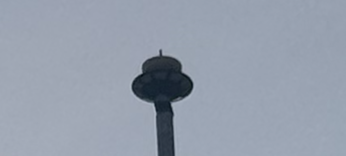 A closeup of the top of the AHS flagpole shows that the top half of the bulb is missing.