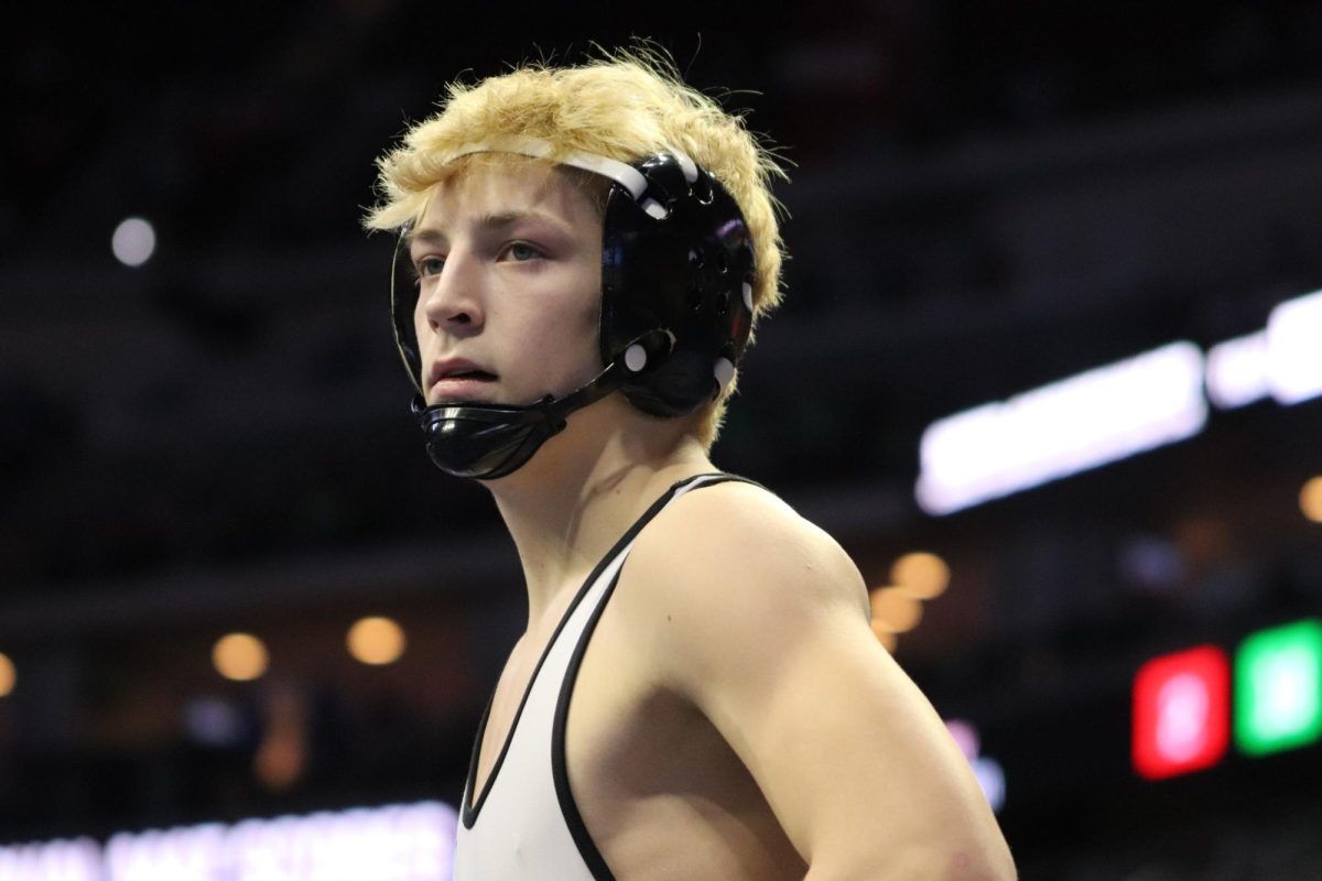 Sophomore Landon Hagen looks to the score after finishing the second period knowing he only has to escape to win this match. Hagen wrestled at the 138 pound weight class for this season. He ended his state performance going 2-2.
