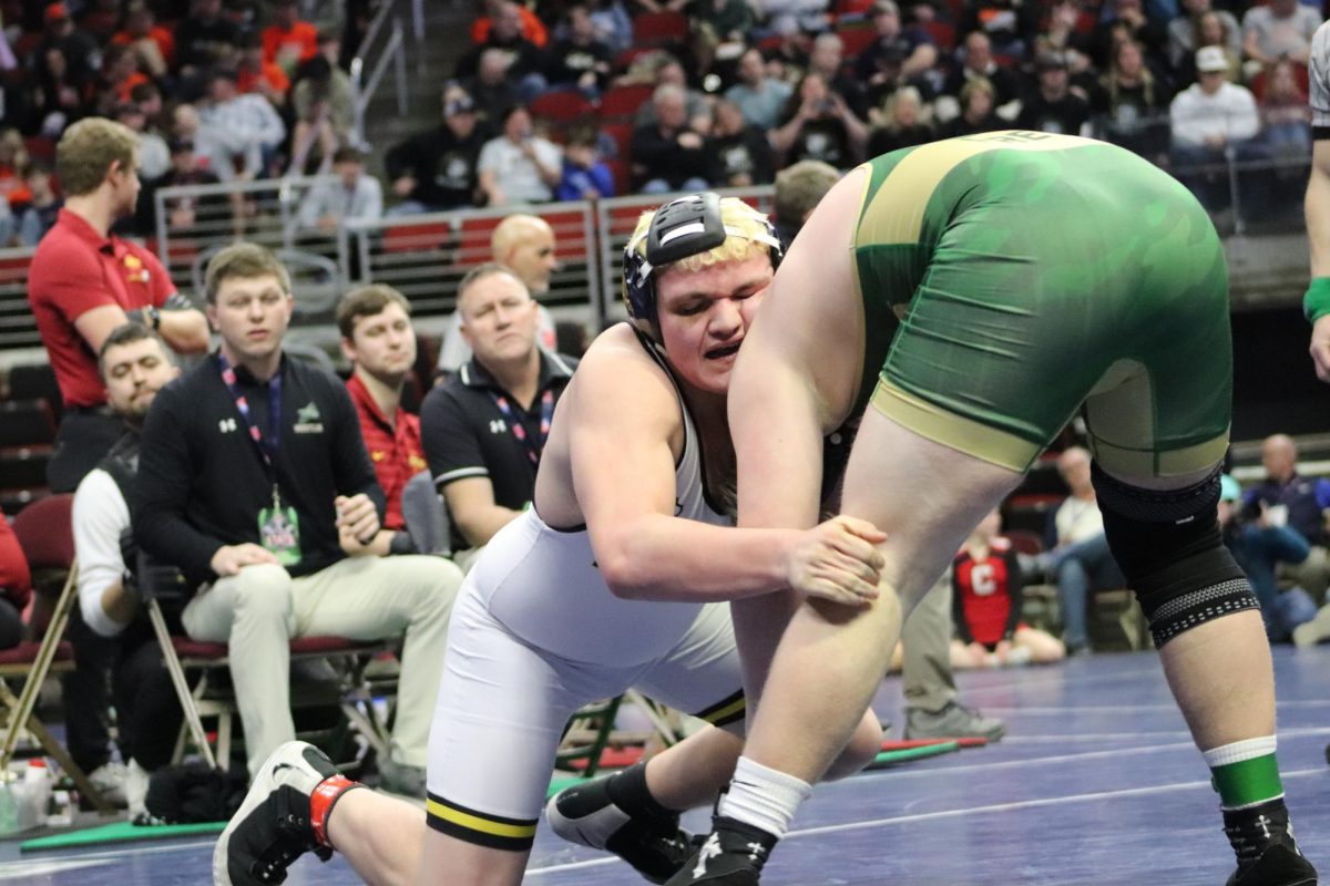 Trevan Thomas a sophomore takes a shot at his opponents leg going for the takedown. Thomas earned a spot as a 215-pound wrestler at the state tournament this year. He has been the Atlantic varsity 215 pounder for his freshman and sophomore year. 