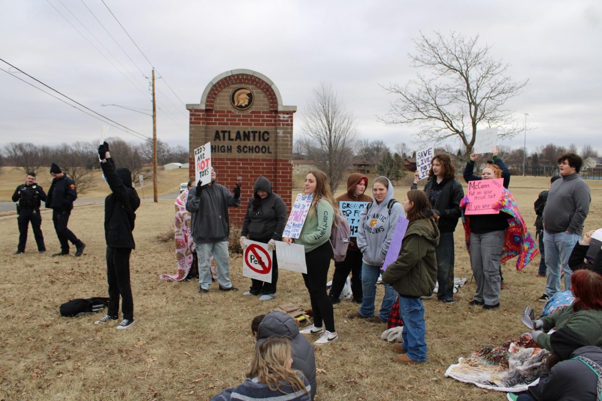Student protesters stand at 14th and Plum. Many were given blankets by members of the community.