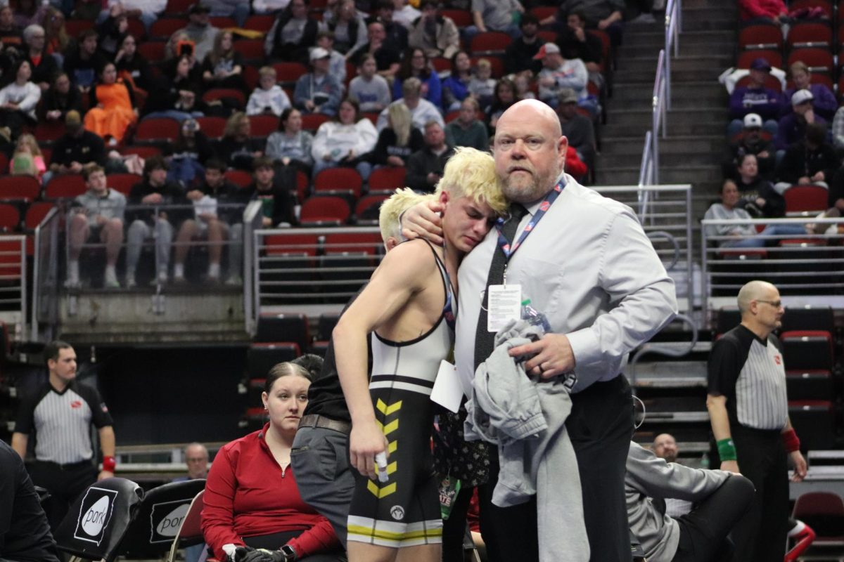 Senior Braxton Hass is embraced by Head Coach Tim Duff after his last match.