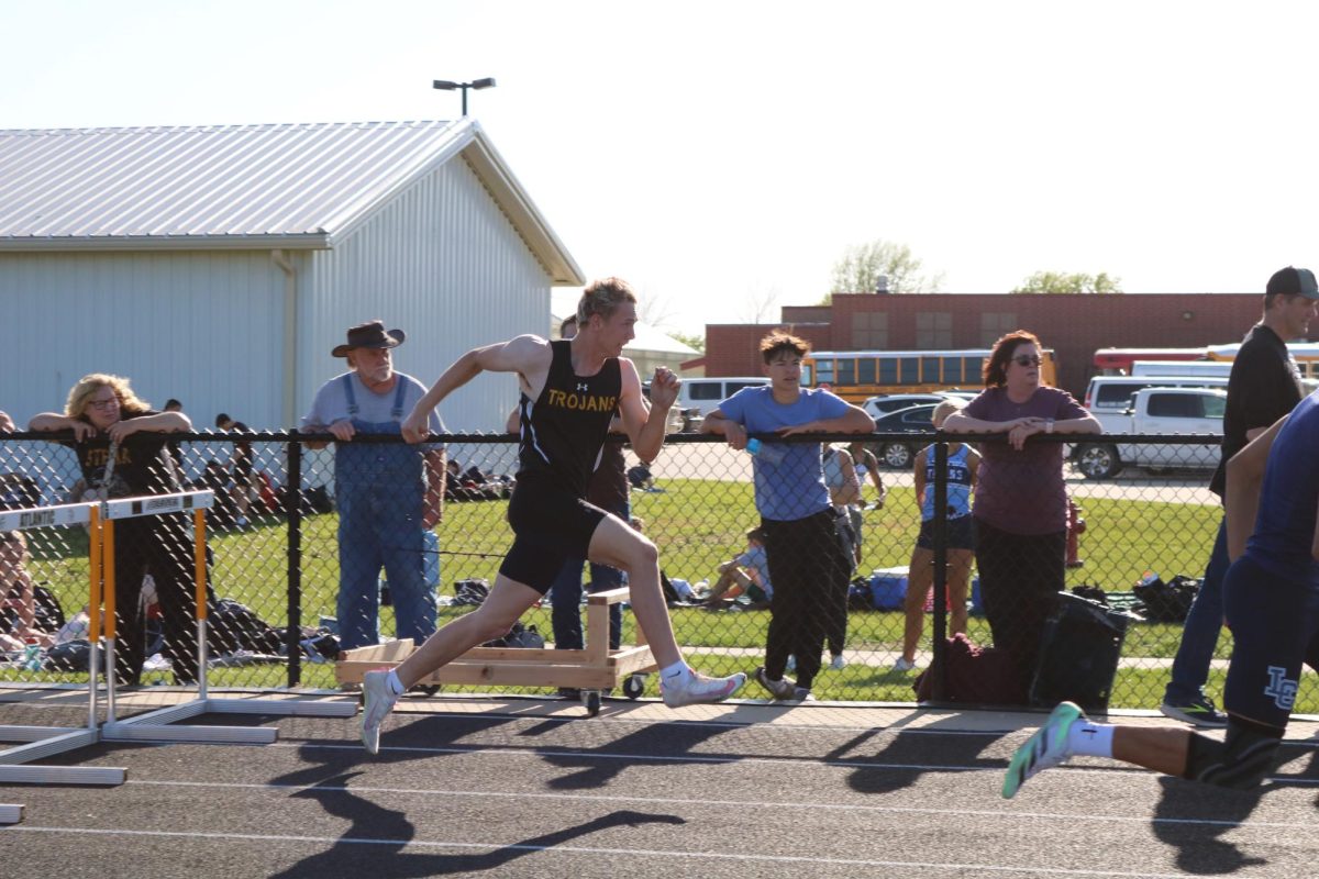 Zander Killion running in the shuttle hurdle at last year's home meet