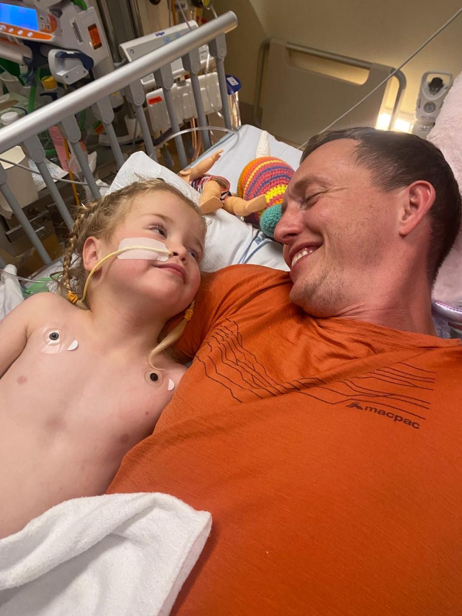 Max Hoegh gazes at his daughter gratefully after she survived a drowning accident. Twenty minutes of CPR sustained her. 