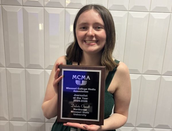 Oswalt holds her Journalist of the Year award. Photo by Hannah Claywell, EIC of The Missourian 2026