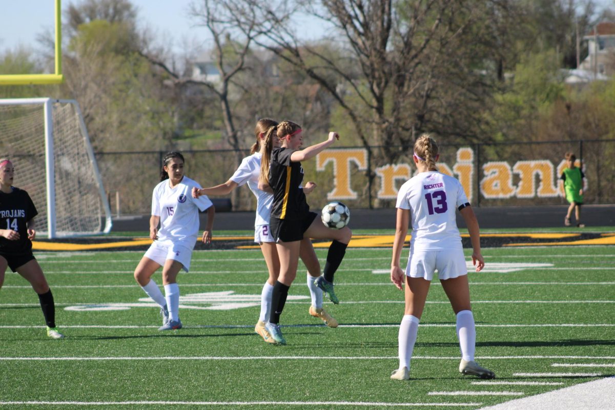 Atlantic midfielder Ella Brummer competes for the ball against the opposing team.