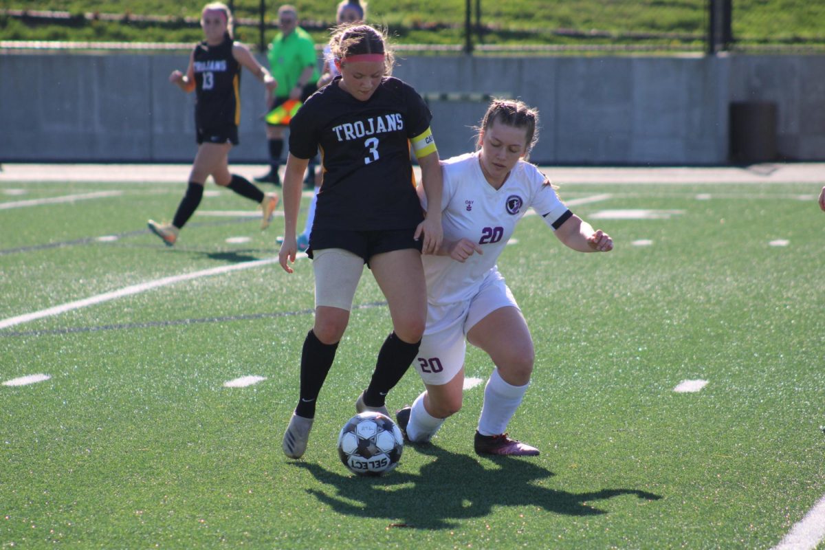 Atlantic Trojan midfielder Aydrie Coffman posseses the ball under pressure in a match against West Central Valley.