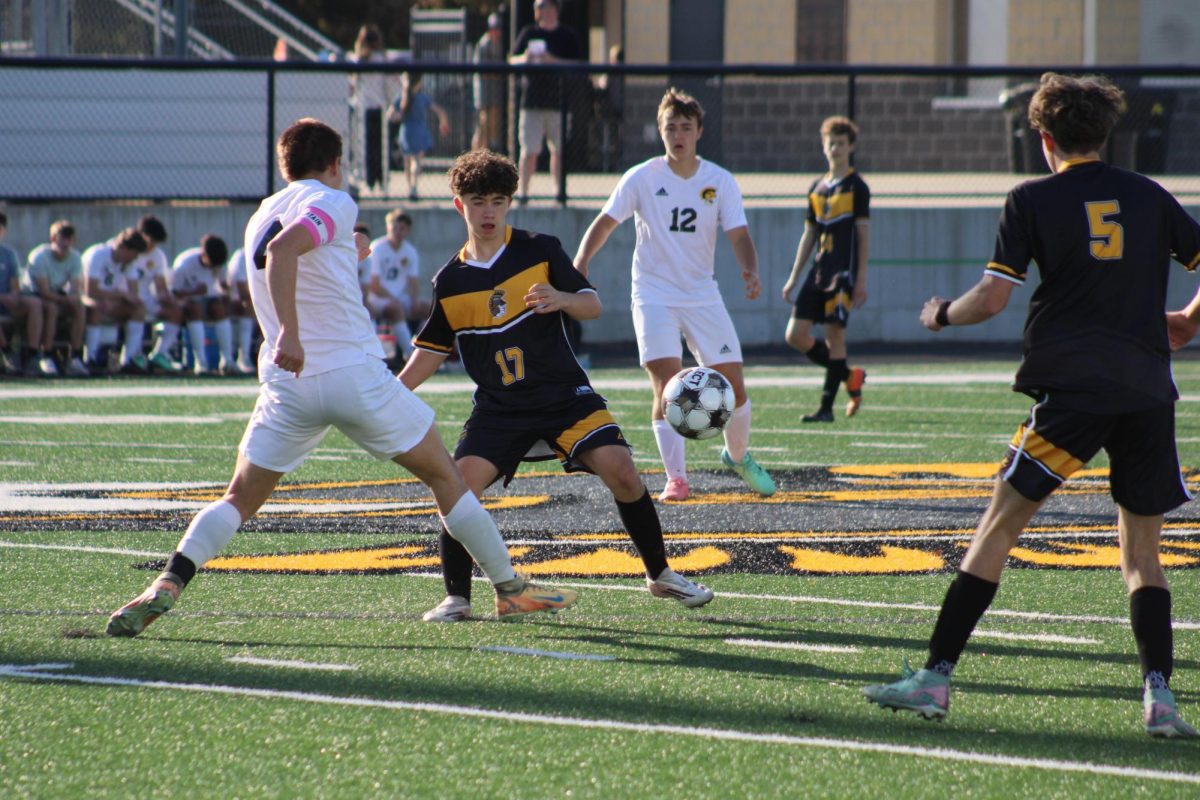 Atlantic forward Cooper Anderson fights for control of the ball with the opposing team Tri-Center.