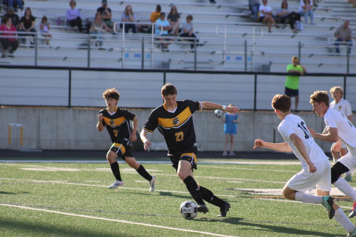 Atlantic forward Trevor Ellison takes the ball against Tri-Center.