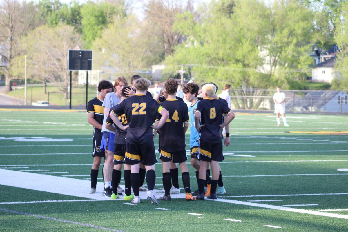 Atlantic Boys Soccer team huddles together to discuss the plays before the start of the game.
