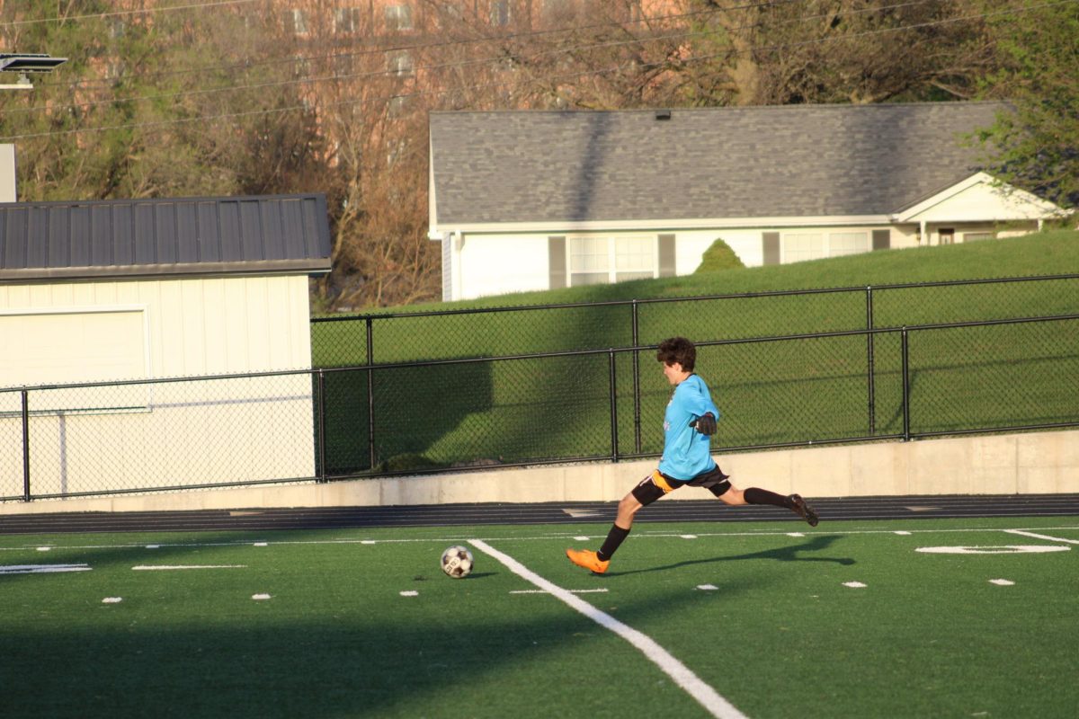 Atlantic Goal keeper Nolan Kinney boots the ball towards the players.