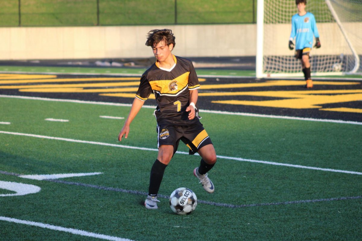 Atlantic midfielder Cristiano Ayala settles the ball on the trojan half against Tri-Center.
