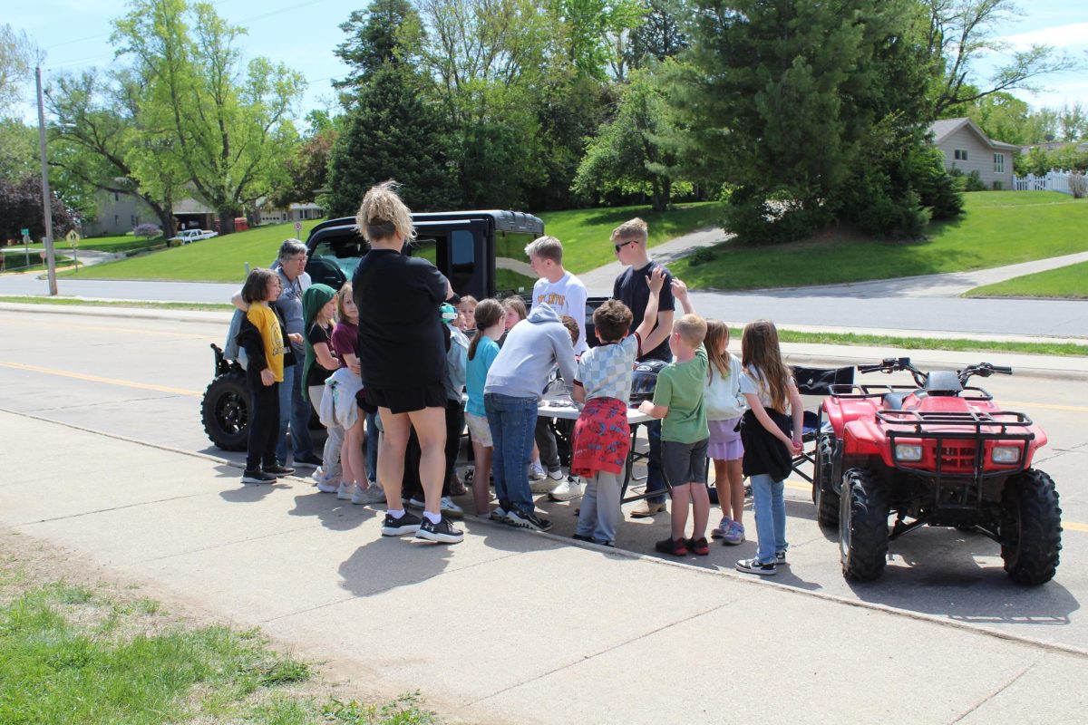 Elementary students look at an ATV during Farm Safety Day.