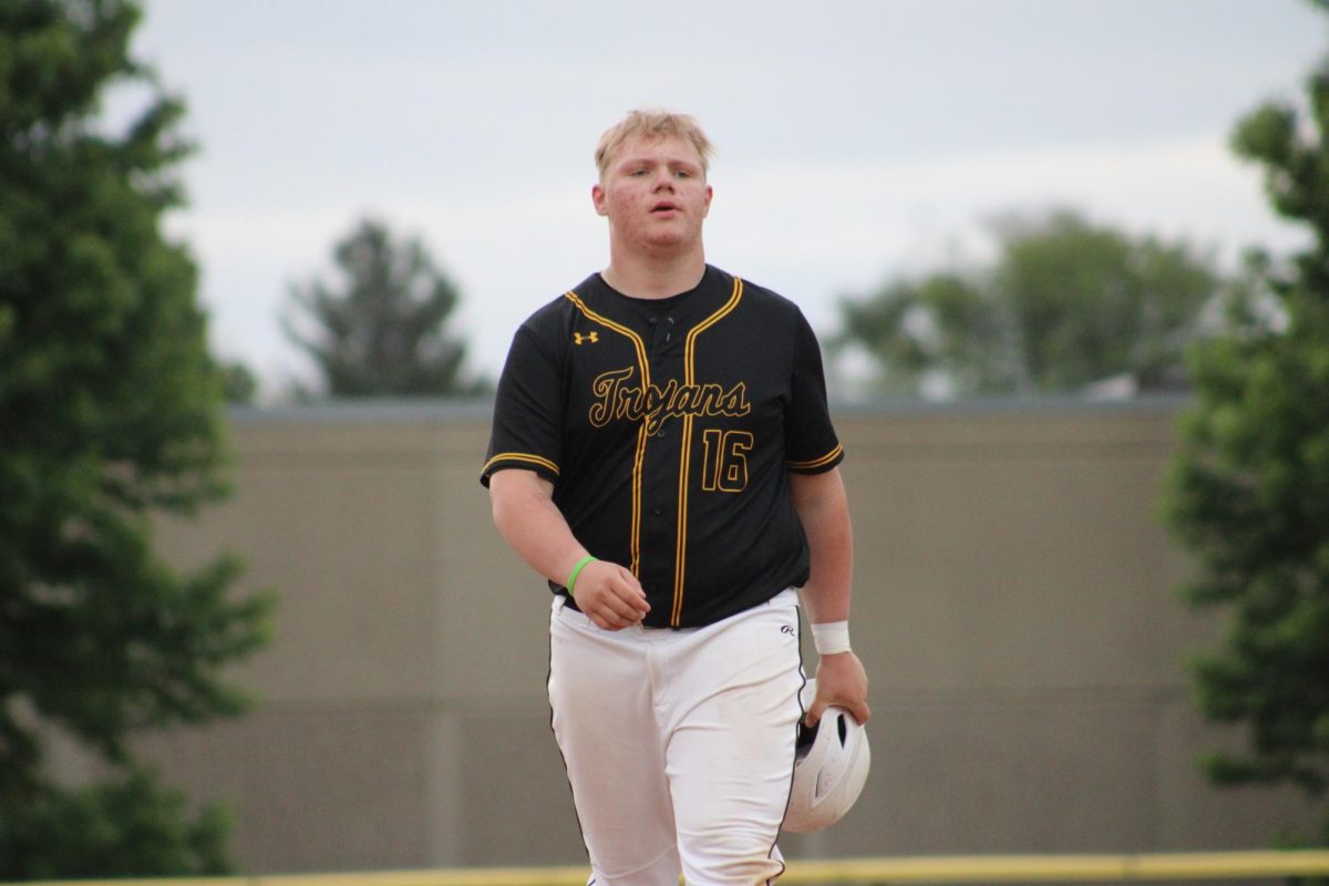 Junior Cooper Woolsey walks off after strike 3.