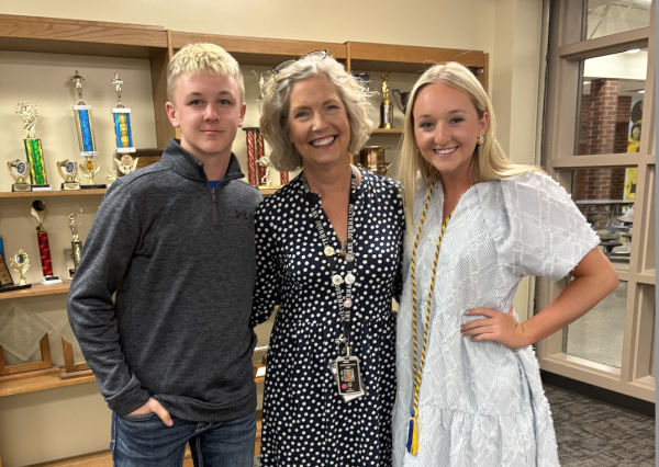Journalism adviser Allison Berryhill pauses for a photo with sibling journalists Keaton and Makenna Schroeder at the April 29 awards night. 
Photo by Becky Schroeder