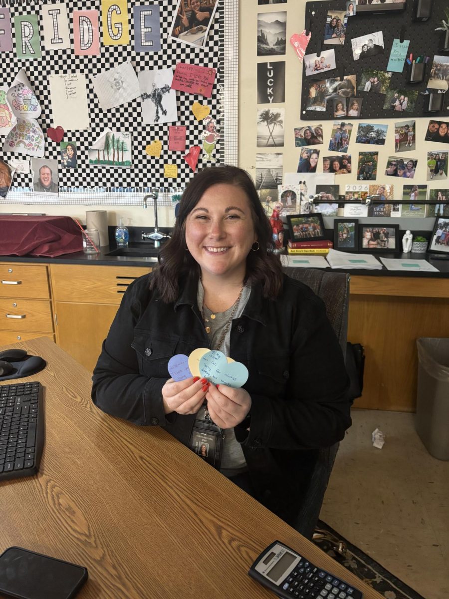 Science teacher Hannah Misner displays hearts students gave her.